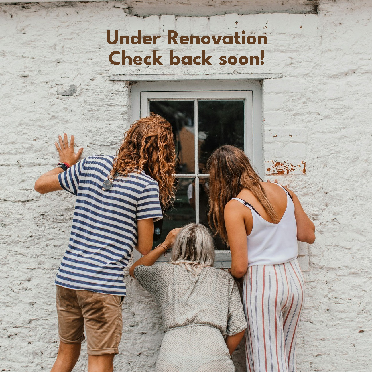 three people peaking into a window.